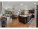Spacious open concept living space with an island, kitchen, and seating areas at 12740 Del Corso Loop, Lakewood Ranch, FL 34211