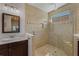 Modern bathroom featuring a walk-in shower with decorative tile surround, glass enclosure, and dual shower heads at 12740 Del Corso Loop, Lakewood Ranch, FL 34211