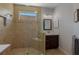 Beautiful bathroom with a walk-in shower, decorative tile surround, glass enclosure, and modern sink with vanity at 12740 Del Corso Loop, Lakewood Ranch, FL 34211