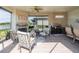 Screened lanai provides an outdoor fireplace, kitchen, seating area and lake views at 12740 Del Corso Loop, Lakewood Ranch, FL 34211