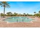 Beautiful community pool with surrounding lounge chairs and lush landscape in the background at 12740 Del Corso Loop, Lakewood Ranch, FL 34211