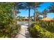 Lush tropical walkway leading to the community pool area and amenities at 12740 Del Corso Loop, Lakewood Ranch, FL 34211
