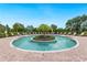 Community pool featuring sun loungers and lush tropical landscaping, great for relaxation and recreation at 12740 Del Corso Loop, Lakewood Ranch, FL 34211