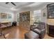 Cozy sitting area with built-in shelving, chair and ottoman, and desk at 12740 Del Corso Loop, Lakewood Ranch, FL 34211