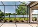 Screened-in patio with gorgeous lake views, perfect for enjoying the outdoors bug-free at 12740 Del Corso Loop, Lakewood Ranch, FL 34211