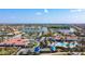 Aerial view of the community featuring a pool, lake, and clubhouse amenities at 13724 Quinta St, Venice, FL 34293