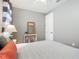 Comfortable bedroom with neutral walls, matching furniture, and bright natural light at 13724 Quinta St, Venice, FL 34293