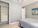 Calm bedroom featuring a spacious closet, light gray walls, and minimalist decor at 13724 Quinta St, Venice, FL 34293