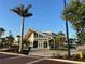 Modern community building with large windows and manicured landscaping on a sunny day at 13724 Quinta St, Venice, FL 34293