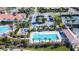 Community amenities include a large pool, lap pool, and recreational area with lush landscaping and plenty of lounge seating at 13724 Quinta St, Venice, FL 34293