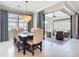 Elegant dining room with a chandelier and views of the outdoor patio seating area at 13724 Quinta St, Venice, FL 34293