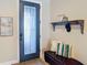 Inviting entryway features stylish decor, a convenient bench, and a modern front door at 13724 Quinta St, Venice, FL 34293