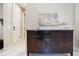 Hallway displays dark wood furniture with a light-colored interior and a decorative accent wall at 13724 Quinta St, Venice, FL 34293