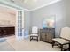 Comfortable living room with neutral paint, plush seating and large glass doors for light and views at 13724 Quinta St, Venice, FL 34293
