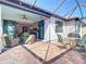Brick patio with lake view, outdoor seating, and easy access to the kitchen at 13724 Quinta St, Venice, FL 34293