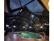 Enclosed pool and jacuzzi illuminated by stylish outdoor lighting at dusk at 14239 Nighthawk Ter, Lakewood Ranch, FL 34202