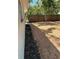 Spacious backyard featuring fresh mulch and a tall wooden privacy fence for added seclusion at 1461 17Th St, Sarasota, FL 34234