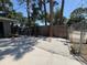 Private fenced backyard with crushed rock and partial stone area, providing a serene outdoor space at 1461 17Th St, Sarasota, FL 34234