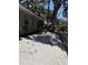 Exterior back yard of home featuring a view of the yard covered in white gravel at 1461 17Th St, Sarasota, FL 34234