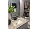 Bathroom vanity with granite countertop, modern faucet, with decorative mirror and interior design at 1461 17Th St, Sarasota, FL 34234