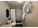 Bathroom featuring tiled walk-in shower with modern fixtures and artistic decor at 1461 17Th St, Sarasota, FL 34234