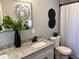 Bathroom featuring modern fixtures, a large vanity and a decorative mirror at 1461 17Th St, Sarasota, FL 34234