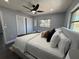 Bright bedroom with king bed, large window, ceiling fan, and closet space for a relaxing comfortable space at 1461 17Th St, Sarasota, FL 34234