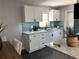 Bright kitchen features white cabinets, granite countertops, and modern fixtures at 1461 17Th St, Sarasota, FL 34234