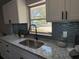 Close-up of kitchen countertops, modern faucet, and white cabinetry at 1461 17Th St, Sarasota, FL 34234