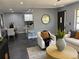 Open concept living room with natural light, and view into dining area and kitchen at 1461 17Th St, Sarasota, FL 34234