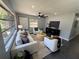 Spacious living area with ample natural light, chic decor, and comfortable seating arrangement at 1461 17Th St, Sarasota, FL 34234