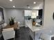 Open concept living space featuring dining room, kitchen with island and modern lighting at 1461 17Th St, Sarasota, FL 34234