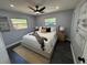 Bright main bedroom with neutral color palette, ceiling fan and carpet flooring at 1461 17Th St, Sarasota, FL 34234
