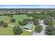 An aerial view of a large park featuring a playground, covered picnic area, and parking lot at 15032 Skip Jack Loop, Lakewood Ranch, FL 34202
