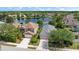 Aerial shot showcases the house, positioned adjacent to a serene lake and neighborhood at 15032 Skip Jack Loop, Lakewood Ranch, FL 34202