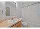 Well-lit bathroom features a single vanity and bathtub with shower at 15032 Skip Jack Loop, Lakewood Ranch, FL 34202