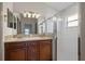 Bathroom features double sinks, granite countertops and a glass shower enclosure at 15032 Skip Jack Loop, Lakewood Ranch, FL 34202