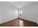 Cozy bedroom features hardwood floors and a window for natural light at 15032 Skip Jack Loop, Lakewood Ranch, FL 34202