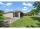 The exterior shows the screened in lanai and a brick path leading to the yard at 15032 Skip Jack Loop, Lakewood Ranch, FL 34202