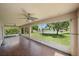 A screened lanai features wood-look tile floors, ceiling fans and expansive views of the lake at 15032 Skip Jack Loop, Lakewood Ranch, FL 34202