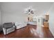 Open-concept living room offers hardwood floors, natural light, and easy access to kitchen at 15032 Skip Jack Loop, Lakewood Ranch, FL 34202