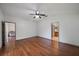 Main bedroom with hardwood floors, ceiling fan, and adjoining sitting room at 15032 Skip Jack Loop, Lakewood Ranch, FL 34202