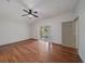 Large main bedroom with hardwood floors, ceiling fan and access to patio at 15032 Skip Jack Loop, Lakewood Ranch, FL 34202