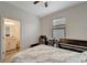 Well-lit bedroom featuring a piano, desk, and ensuite bathroom providing a comfortable and functional space at 15719 Barefoot Beach Dr, Lakewood Ranch, FL 34211
