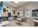 Comfortable lounge area with a coffee machine, modern decor, and seating, perfect for relaxation and socializing at 15719 Barefoot Beach Dr, Lakewood Ranch, FL 34211