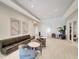 Inviting lounge area featuring comfortable seating, contemporary artwork, neutral colors, and a relaxed atmosphere at 15719 Barefoot Beach Dr, Lakewood Ranch, FL 34211