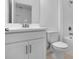 Bright, modern bathroom featuring a white vanity with ample storage and a clean, minimalist design at 1599 Laurel Brook Ln, Port Charlotte, FL 33953