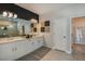 Modern bathroom with double vanity, sleek fixtures, a large mirror, and decorative accents at 1599 Laurel Brook Ln, Port Charlotte, FL 33953