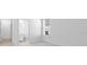 A neutral bedroom with a view into an en-suite bathroom at 1599 Laurel Brook Ln, Port Charlotte, FL 33953