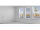 Bright bedroom with large windows overlooking a lake or pond with views of nearby houses at 1599 Laurel Brook Ln, Port Charlotte, FL 33953